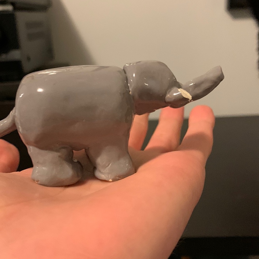 Folk art elephant made out of clay